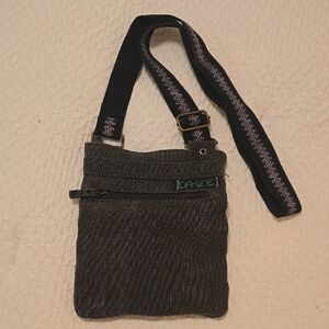 Dakine crossbody bag with Adjustable Strap and Zipper Closure
